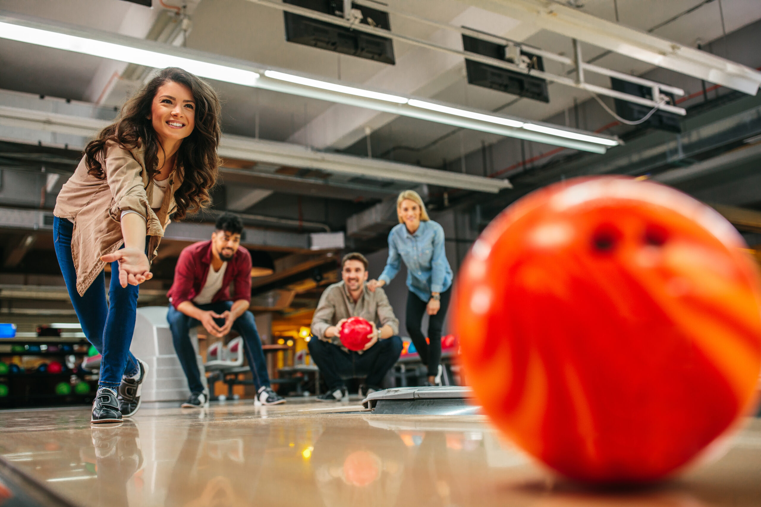 Shot of an attractive young woman bowling